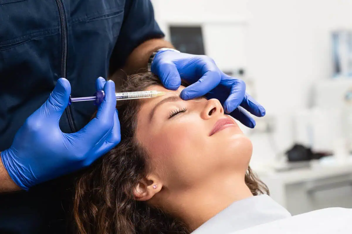 Woman receiving a preventative Botox treatment for forehead lines at Divine Age Med Spa in Wesley Chapel, FL.