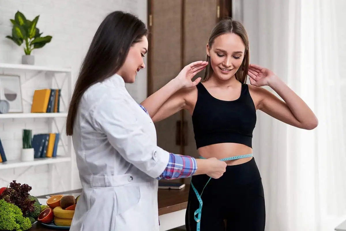 Woman receiving a medical weight loss consultation and body measurements in Wesley Chapel, FL.